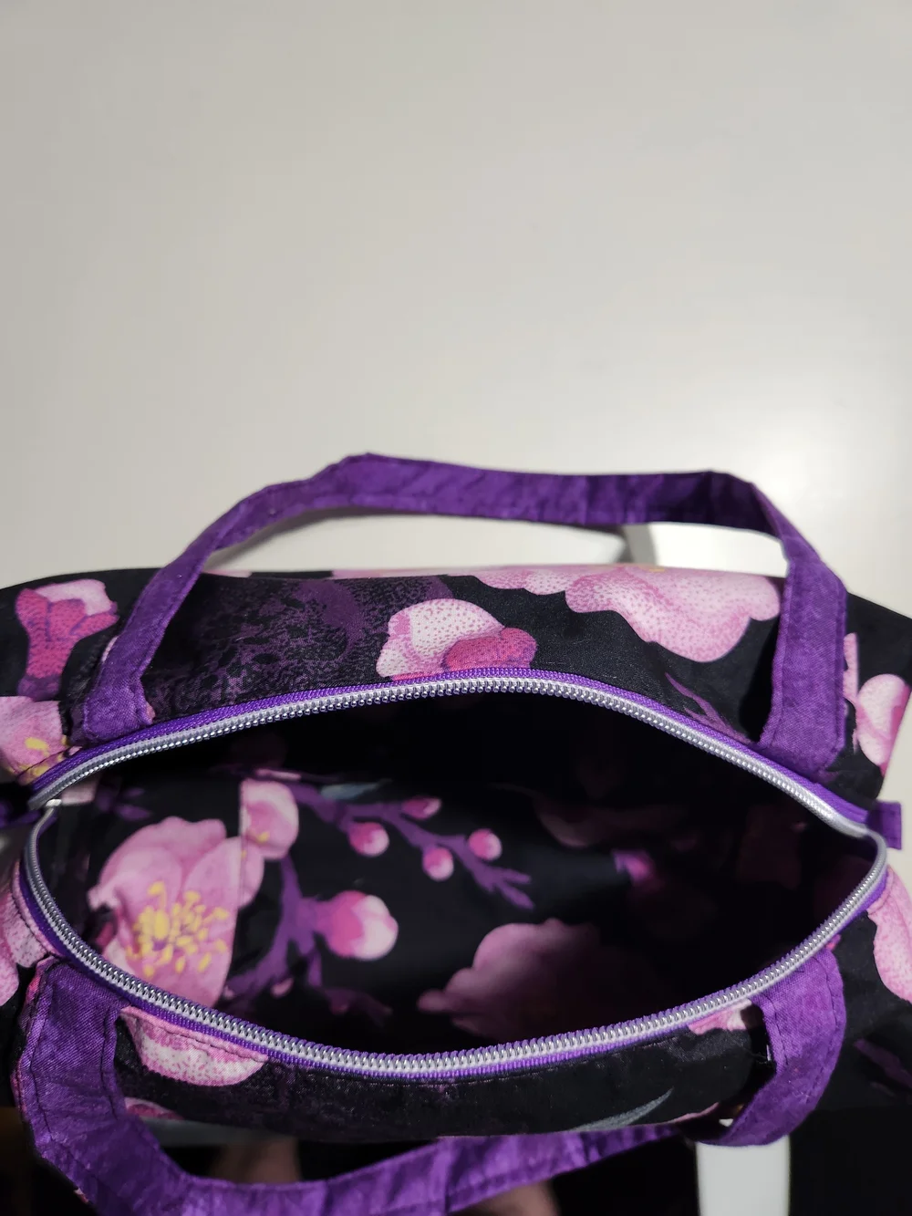 Purple Floral Cosmetic Bag with Black Background